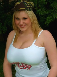 Busty Ashley shows off her huge boobs in bed